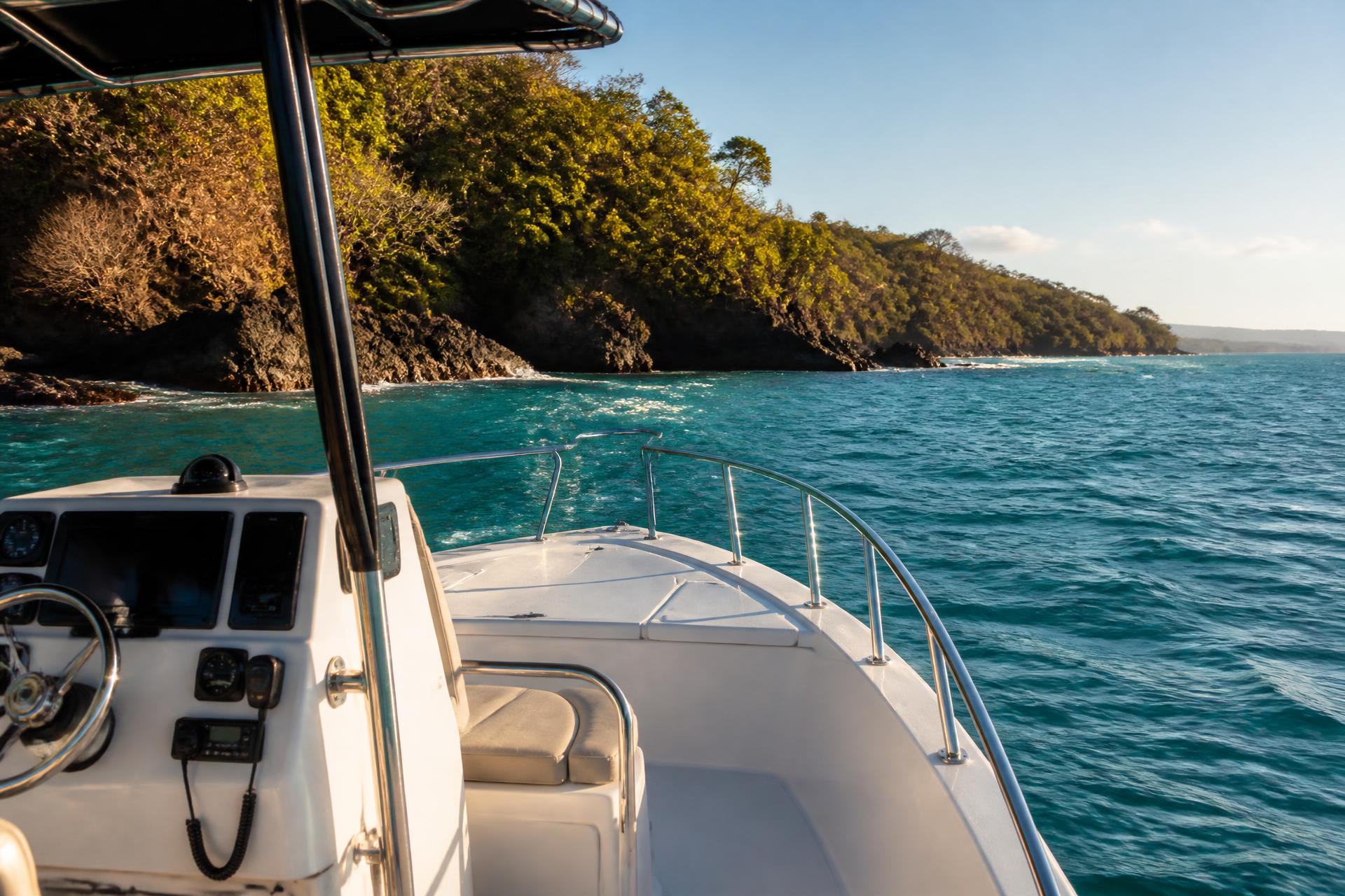 Private boat cruising turquoise water along the Guanacaste coast of Costa Rica